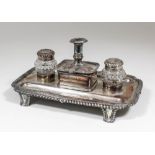 A 19th Century Sheffield plate rectangular inkstand with gadroon mounts to rim, on panelled feet,