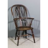 A mid 19th Century yewwood and elm seated stick back Windsor chair by F. Walker of Rockley, the