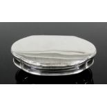 A William IV silver snuff box of shaped outline with plain slightly domed lid and shaped thumbpiece,