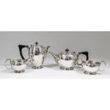 An Edward VIII silver four piece tea service of circular bulbous form, comprising - tea pot with