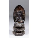 A Japanese carved wood and lacquer figure of Amida Buddha seated on a lotus pedestal, 8.5ins (260mm)