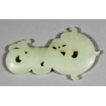 A Chinese white jade pendant carved in the form of a dragon carp in profile, with head turned