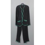 A 1960s lady's Ossie Clark trouser suit in fine black crepe, the edges bound in emerald green satin,