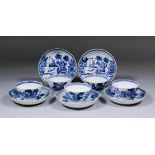 Five Chinese blue and white porcelain tea bowls and saucers painted with pavilions, islands and