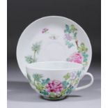 A Chinese "Famille Rose" Export porcelain cup and saucer enamelled with flowering peony (Guangxu