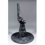 A black painted cast aluminium model of a sleeved left hand holding a pistol, 24.6ins, mounted on