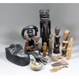 An interesting collection of West African carved wooden objects, including - Mask with distinctive