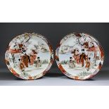 A pair of  Japanese Kutani porcelain chargers enamelled in colours and gilt with figures in a