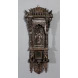 An Indian carved hardwood hanging statue stand, carved in the form of an ancient temple supported by