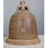 A dated Chinese large cast iron temple bell of domed form with double headed dragon loop handle,