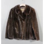 A 1960's Edler Pelz lady's dark mink short jacket with brown satin lining, 40ins chest, 27ins long