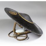 A Japanese Samurai Jingasa (travelling hat) of circular form, finished in black lacquer with a