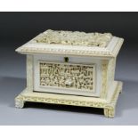 A Chinese ivory rectangular casket, the top deeply carved in bold relief with a shepherd and his