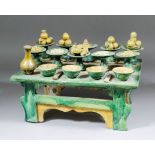 A Chinese Sancai glazed pottery offerings table on shaped supports, 14.75ins (375mm) x 10ins (255mm)