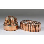 Two Victorian copper jelly moulds, the first of oval lobed gadrooned form, marked with the Orban