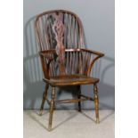 A 19th Century elm and yew wood two tier stick back Windsor armchair with arched crest rail, pierced