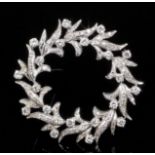A modern silvery coloured metal mounted all diamond set garland pattern brooch, 36mm diameter (