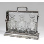 A silver plated rectangular three bottle tantalus, 13.5ins wide x 5.5ins deep x 11.5ins high, and