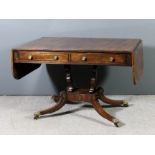 A George IV figured mahogany sofa table inlaid with brass stringing, the top with rosewood