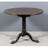 An early George III "Cuban" mahogany circular tripod occasional table with solid one piece top,