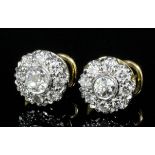 A pair of modern 18ct gold mounted all diamond set flowerhead pattern earrings (for pierced ears),