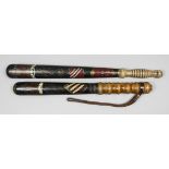 A late Victorian turned wood truncheon painted with the "VR" cipher under a crown above "1893", with