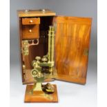 A Victorian lacquered brass single lens microscope by Baker, 244 High Holborn, London, with rack and