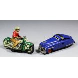 A Schuco Curvo 1000 clockwork tinplate motorcycle - Green motorcycle with red and brown rider and