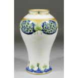 A Moorcroft Macintyre pottery baluster shaped vase painted in colours and gilt with the "Honesty"