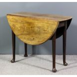 A George III mahogany oval drop leaf cottage dining table on turned legs and pad feet, 42ins x 36ins