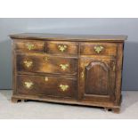 An old oak dresser base with moulded edge to top, fitted three frieze drawers above two deep drawers