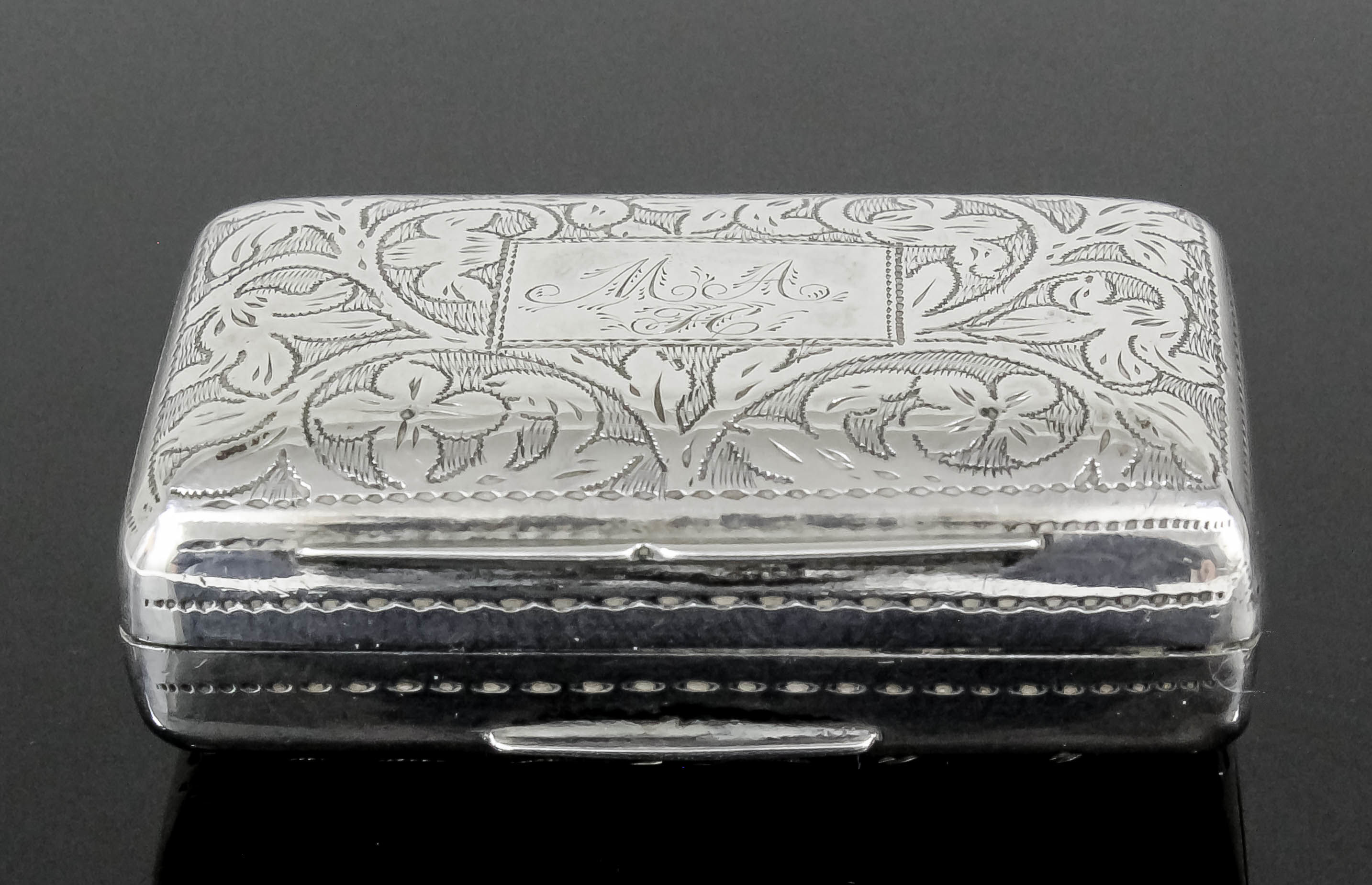 A William IV silver rectangular vinaigrette, the lid and base engraved with floral and leaf scroll