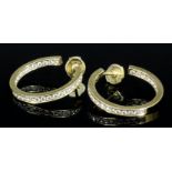 A pair of modern Cartier 18ct gold diamond set earrings (for pierced ears), the 23mm diameter
