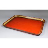 An early 19th Century English red lacquered and gilt decoratede rectangular papier-mache tray, 26ins