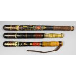 A Victorian turned wood truncheon painted with a crown over the royal cipher above gilt and red