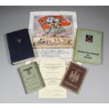 A small collection of German World War II papers and books, documents, and other paperwork