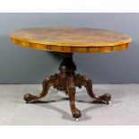 A Victorian figured walnut oval breakfast table, the matched quarter veneered top with moulded edge,