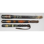A Victorian turned wood truncheon painted with the full royal arms and supports over the royal