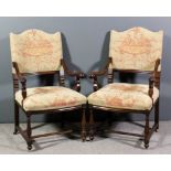 A pair of 19th Century walnut framed open armchairs, the shaped backs and seats upholstered in cream