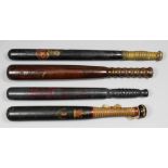 A Victorian turned wood truncheon painted with a gilt and red cartouche and the letters "CGC" (