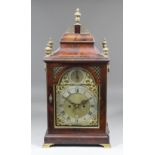 A George III mahogany table clock by Budgen of Croydon, the 6.75ins arched brass dial with
