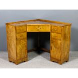 A 1930s walnut kneehole corner dressing table of Art Deco design, fitted drawer to kneehole