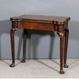 A George II 'Cuban' mahogany rectangular card table with bold rounded front corners, the baize lined