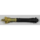A Victorian brass and ebony handled tipstaff, the gilt crown surmounting a gilt plate engraved "