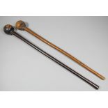 A late 19th Century South African hardwood knobkerrie, 28ins, and another hardwood club with off-