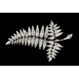 A late Victorian gold and silvery coloured metal mounted all diamond set fern pattern brooch, the