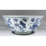 A Chinese blue and white porcelain bowl, the exterior decorated with carp and flowers and the