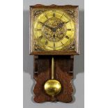 An oak wall clock, the 8ins square brass dial inscribed "F.H. Pratt of Derby" to the eight day fusee