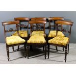 A set of six George IV rosewood dining chairs with plain narrow crest rails scroll and leaf carved
