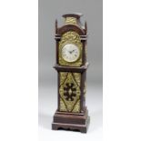 An early 20th Century oak and brass mounted miniature longcase timepiece, the 2.25ins diameter